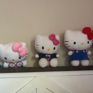Hello Kitty Trio with Pink, Red, and Blue Outfits